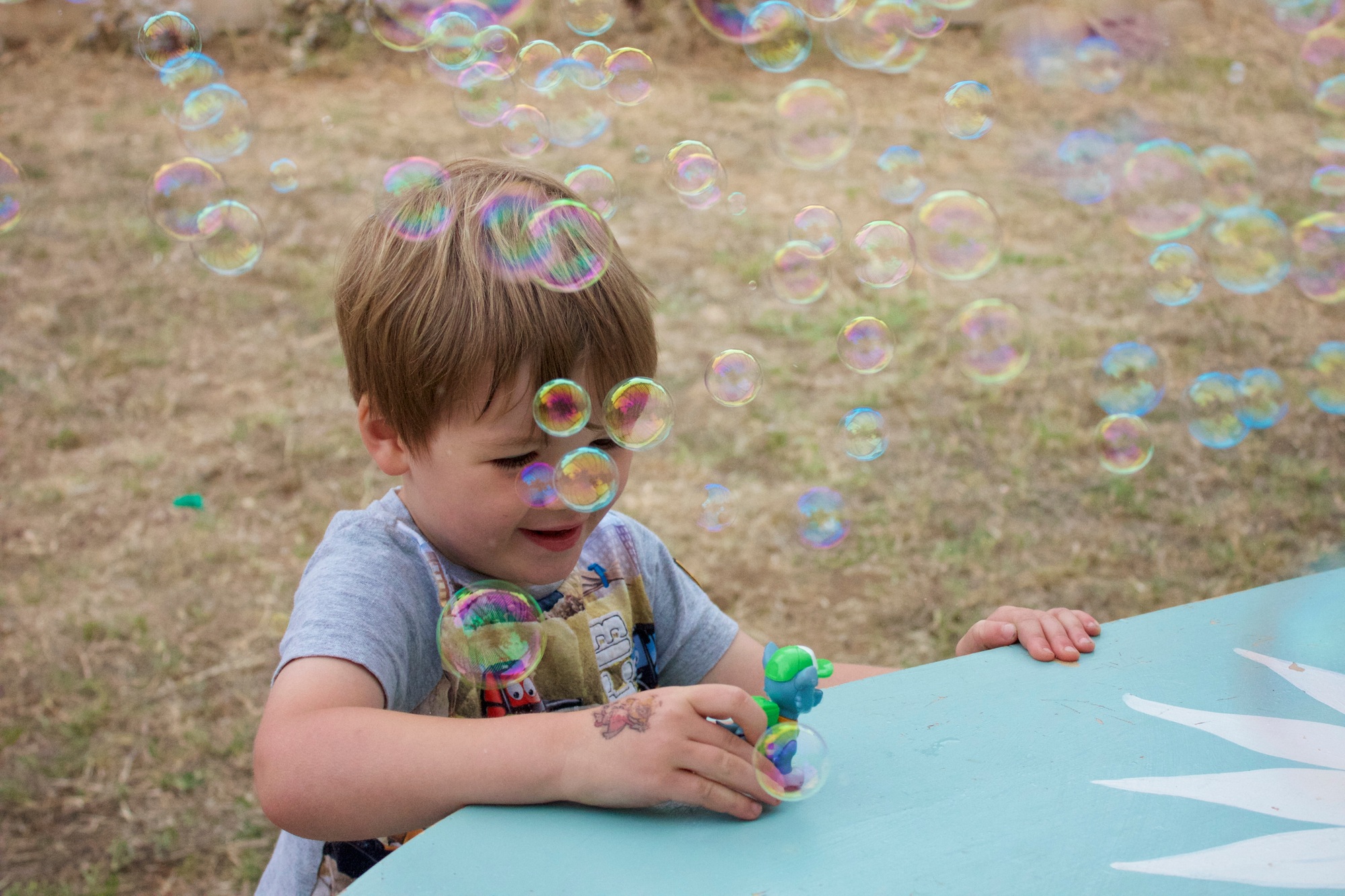 Child playing in bubbles