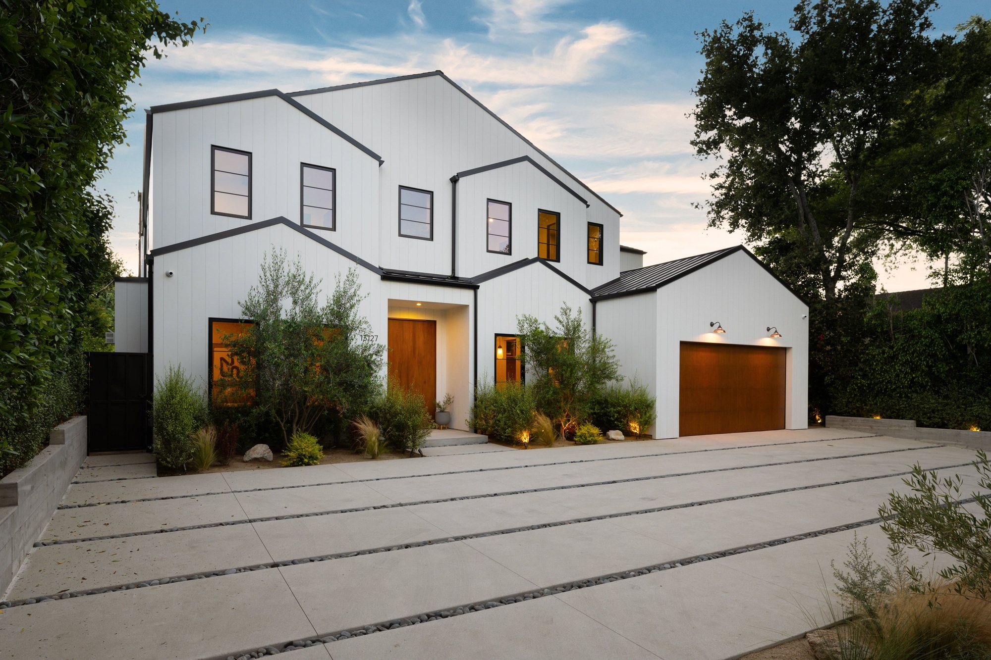 Modern white house exterior with wooden accents.
